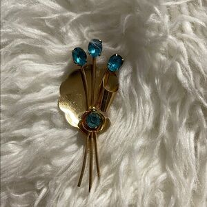 Vintage 1940s Gold-tone Cora Brooch with Blue Crystal Accents